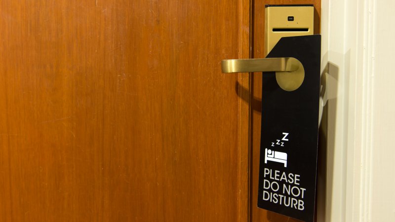 Do not disturb sign hang on door knob perhaps the occupant is recovering from jet lag