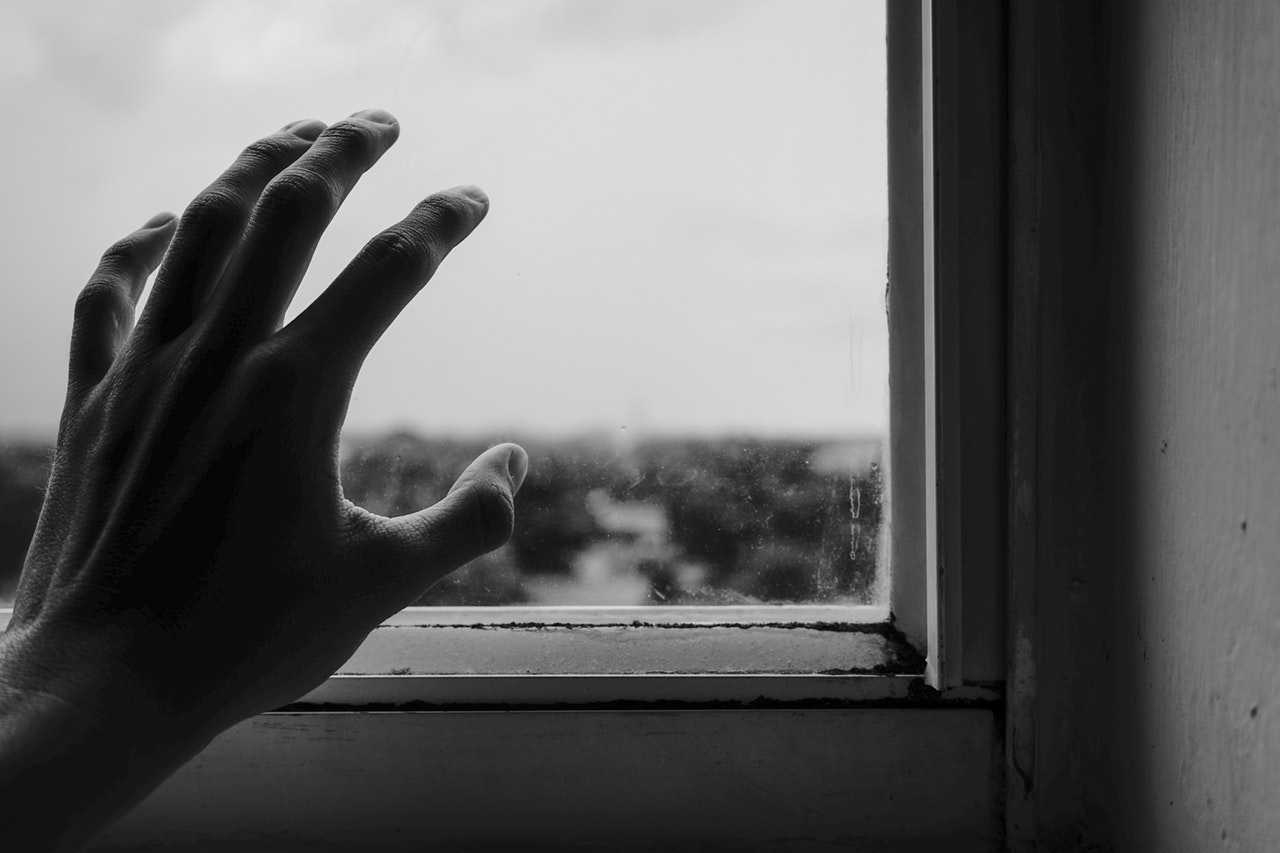 hands at window