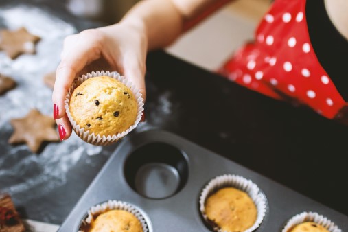 Female hands holding a muffin