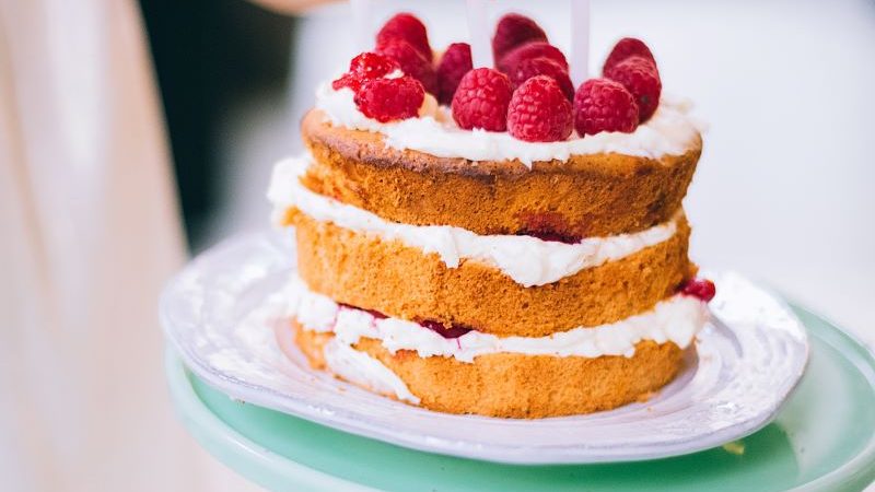sponge cake with cream and raspberries