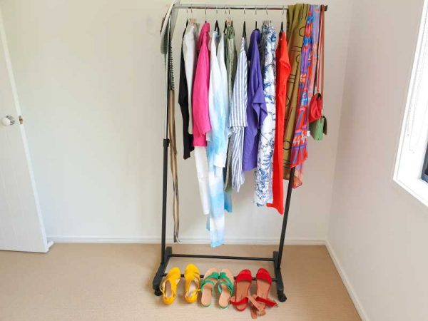 a rack of bright clothing and shoes