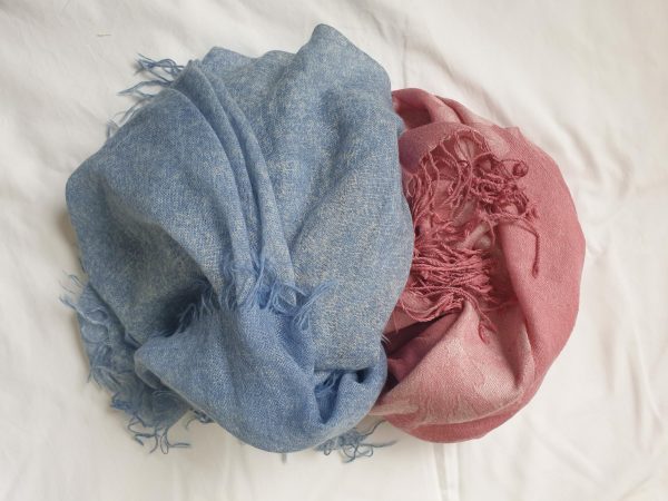 a pink and a blue wrap, both are must pack for travelling