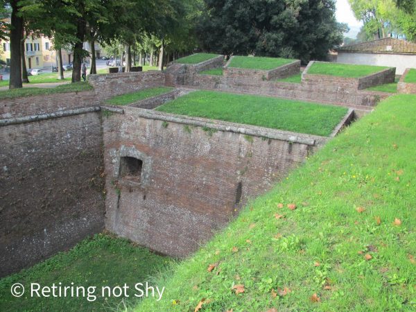 Fortifications stone walls topped with grass in Lucca, Italy