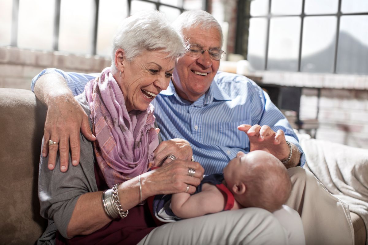 grandparents singing with grandbaby - one of many valuable things to do with new baby